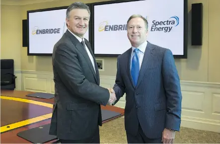  ?? ENBRIDGE AND SPECTRA ENERGY ?? Al Monaco, left, president and chief executive of Enbridge Inc., and Greg Ebel, chairman, president and chief executive of Spectra Energy Corp., shake hands in September after announcing Enbridge’s $42.8-billion acquisitio­n of Spectra.