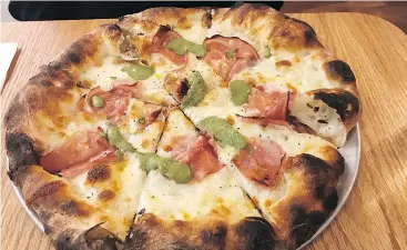  ??  ?? The pistachio e mortadella pizza is a simple yet delicious taste of Italian heaven that’s served up at Mangia Cucina and Bar on Manitoba Street in Vancouver.