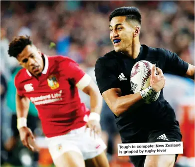  ??  ?? Tough to compete: New Zealand is gripped by rugby fever