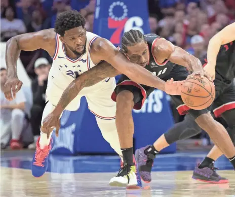  ?? BILL STREICHER/USA TODAY SPORTS ?? Joel Embiid, left, says he leans on Sonny Hill because of how much basketball he knows and has seen.