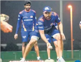  ?? TWITTER/MI ?? Mumbai Indians skipper Rohit Sharma and Jasprit Bumrah during nets in UAE.