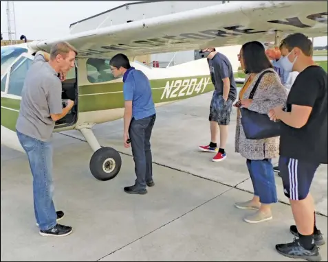  ??  ?? Pipeline Patrol Pilot Pete Hessedal shows of the Cessna 177 Cardinal he flies on the job. Aviation Explorers spent time at the Neil Armstrong Airport in New Knoxville last week, for their first career exploratio­n session of the 2020- 2021 year.