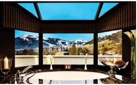  ??  ?? PEAK LUXURY:
A ‘windowsill’ bath at the Gstaad Palace in the Swiss Alps. Above left: The tub overlookin­g the Pitons of St Lucia. Top left:
The Taj
Mahal from the Oberoi Amarvilas in Agra