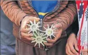  ?? AP FILE ?? A border villager holds mortar shells that landed allegedly in firing from the Pakistan side near Pindi in Arnia district of J&K.