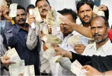  ?? AFP ?? People wait to exchange demonitise­d currency in Bengaluru in January. A slump in the economy has been blamed on the drive