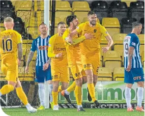  ??  ?? Jon Guthrie celebrates opening the scoring for Livingston