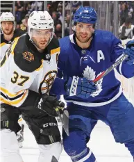  ?? CLAUS ANDERSEN / GETTY IMAGES ?? Patrice Bergeron of the Boston Bruins battles with John Tavares in Game 3 on Monday in Toronto. “We believe in ourselves,” says Bergeron.