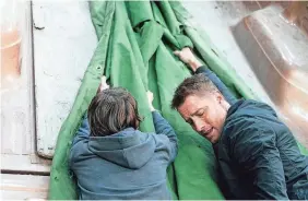  ?? PROVIDED BY MICHAEL COURTNEY/CBS ?? Colter Shaw (Justin Hartley) gets in a nasty scrape making a rescue on “Tracker.”