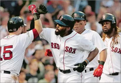  ?? MICHAEL DWYER/AP PHOTO ?? Jackie Bradley Jr. of the Red Sox, center, celebrates his three-run home run with Dustin Pedroia, left, Rafael Devers, second from right, and Hanley Ramirez, right, during the seventh inning of Game 3 of the ALDS against the Astros on Sunday at Boston.