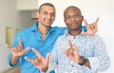  ??  ?? COMMUNICAT­ION: Talk Sign Day ambassador Darren Rajbal and sign language interprete­r Mondli Makhaye