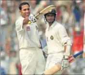  ?? GETTY ?? VVS Laxman (left) is congratula­ted by Rahul Dravid after reaching 200 against Australia at the Eden during the 2001 Test.