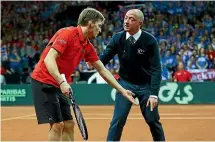  ??  ?? David Goffin, left, and Gael Monfils make their points to match officials.