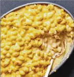  ?? FOOD STYLIST: BARRETT WASHBURNE. TESTANI/NEW YORK TIMES ?? Inspired by Stouffer’s mac and cheese, in the red box from the freezer aisle, this homemade version delivers the same molten creaminess. The sauce-to-pasta ratio is really what makes Stouffer’s mac and cheese.