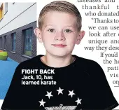  ??  ?? FIGHT BACK Jack, 10, has learned karate