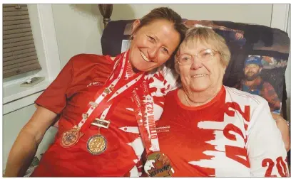  ?? SUBMITTED PHOTO ?? WO Charlene Arsenault is congratula­ted by her mother, Evelyn Arsenault of Tignish, after winning a Canadian Armed Forces national military marathon. WO Arsenault describes her mother as her biggest fan and supporter. WO Arsenault is a 31-year veteran...