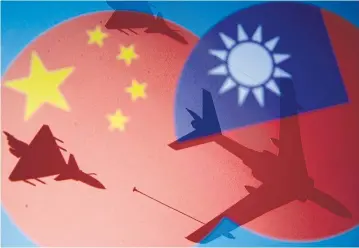  ?? REUTERS ?? Chinese, Taiwanese flags and military airplanes are seen in this illustrati­on.