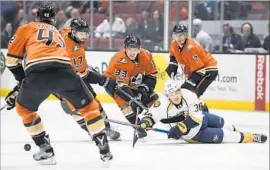  ?? Mark J. Terrill Associated Press ?? VIKTOR ARVIDSSON of the Predators is surrounded by Josh Manson (42), Ryan Kesler (17), Jakob Silfverber­g (33) and Andrew Cogliano of the Ducks.