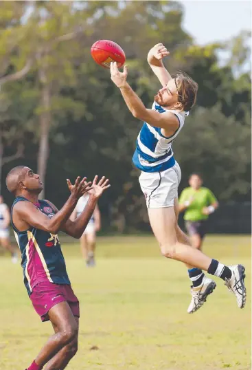  ?? Pictures: BRENDAN RADKE ?? FLYING HIGH: Port Douglas's Skip Gribbon takes a mark unconteste­d in the Crocs’ match against Cairns City Lions at Holloways Beach sporting complex on Saturday.