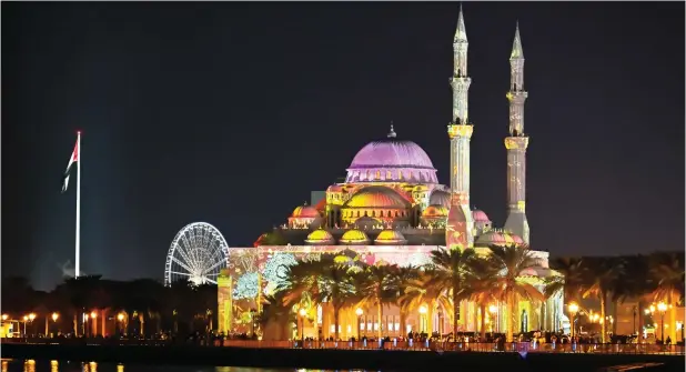  ?? PHOTOS BY MUHAMMAD SAJJAD ?? The iconic Al Noor Mosque illuminate­d with colourful lights during the Sharjah Light Festival 2024.