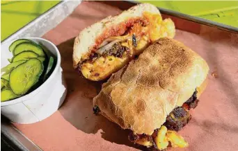  ?? Mike Sutter/Staff file photo ?? Dignowity Meats: Go for the Burnt End Melt with mac and cheese, and barbecue sauce on ciabatta bread.