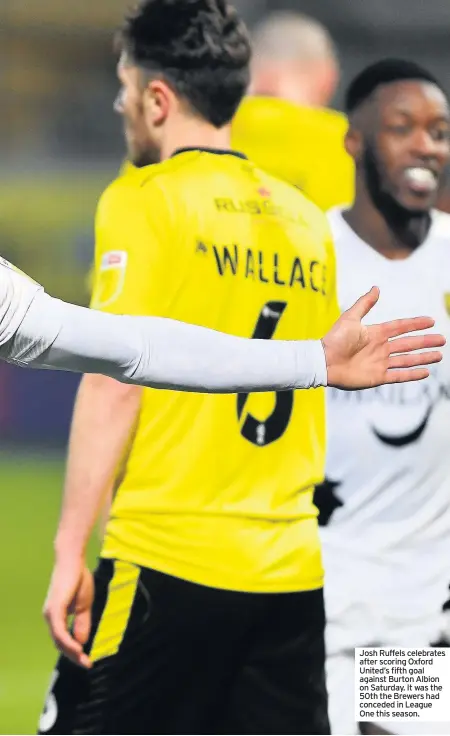  ??  ?? Josh Ruffels celebrates after scoring Oxford United’s fifth goal against Burton Albion on Saturday. It was the 50th the Brewers had conceded in League One this season.