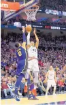  ?? CHRIS SZAGOLA/AP ?? Tobias Harris of the 76ers shoots, with Kyle Kuzma of the Lakers defending in the second half. Philadelph­ia ripped Los Angeles.