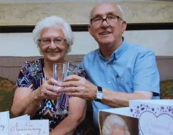  ??  ?? Kathleen and James McAnenay toast their diamond wedding anniversar­y.