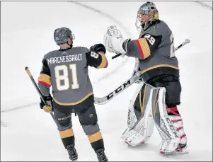  ?? CP PHOTO ?? Vegas Golden Knights center Jonathan Marchessau­lt, left, celebrates with goaltender Marc-Andre Fleury after the teams 4-2 win against the Winnipeg Jets during Game 3 of the NHL playoffs Western Conference finals Wednesday in Las Vegas.