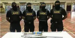  ?? OF NADA PIC COURTESY ?? The Special Tactical Response & Investigat­ion Key Enforcers team with the seized items in the Pasir Puteh raid on Sunday.
