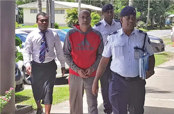  ?? Photo: Waisea Nasokia ?? The accused Ashish Sen is escorted by Police officers outside the Sigatoka Magistrate’s Court on March 18, 2024.