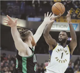  ?? AP PHOTO ?? GOOD LOOK: Indiana’s Lance Stephenson shoots over Aron Baynes during the first half of last night’s Celtics game in Indianapol­is.