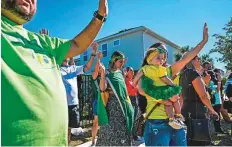  ?? AFP ?? Supporters of Jair Bolsonaro pray for his health outside his rental house at the Encore Resort at Reunion in Florida.