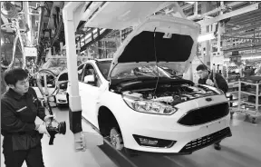  ?? PROVIDED TO CHINA DAILY ?? Workers on the production line of Changan Ford in a factory in Harbin, Heilongjia­ng province.