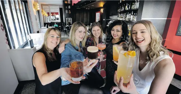  ?? MARK VAN MANEN/PNG ?? Servers Kelly Heward, Olivia Povarchook, Jasmine Radu, Lily Duong and Sabrine Dhaliwal show some of Uva Wine &amp; Cocktail Bar’s happy hour drinks.