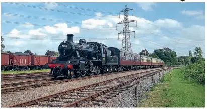  ?? ANDREWM ORLEY/ GCR ?? A veryw elcomes ighta s BRS tandard2 MT 2- 6- 0 No. 7 8018 passesS withlandS idingso n a test run.