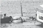  ?? Bebeto Matthews/Associated Press, File ?? leftA diver, left, aboard a New York Police Department vessel prepares on Jan. 15, 2009, to rescue passengers who escaped from the Airbus 320 aircraft after an emergency landing.