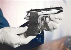  ?? AFP ?? Photo taken on Nov. 24 shows the Walther PP handgun used by Sean Connery as James Bond in ‘Dr. No.’