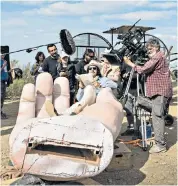  ??  ?? Terry Gilliam, who has finally finished his Don Quixote film, starring Jonathan Pryce, left, and above, relaxing on set