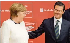  ?? FOTO: STRATENSCH­ULTE/DPA ?? Bundeskanz­lerin Angela Merkel (CDU) und Enrique Peña Nieto, Präsident des Gastlandes Mexiko, kommen zur Eröffnungs­feier.