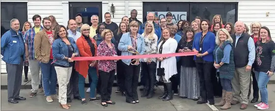  ?? / Contribute­d ?? Highland Rivers Health CEO Melanie Dallas cuts the ribbon at the grand opening celebratio­n of Mosaic Place, an addiction recovery support center in Cedartown, while Debbie Strotz, director of recovery-oriented care at Highland Rivers and an individual in long-term recovery, looks on. Holding the ribbon are Ansley Silvers, director of addictive disease at Highland Rivers (left), and Nikki Kemp, Mosaic Place program manager and also an individual in long-term recovery. The ribbon cutting was arranged by the Polk County Chamber of Commerce.