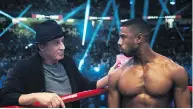  ?? METRO GOLDWYN MAYER PICTURES / WARNER BROS. PICTURES ?? In Creed II, Adonis Creed, right, battles the son of one of Rocky Balboa’s old adversarie­s.