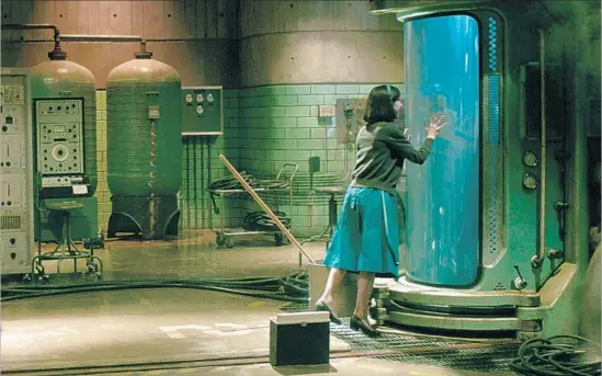  ?? Fox Searchligh­t Pictures ?? SALLY HAWKINS stars as a mute cleaning woman at a government facility who feels connected to a strange creature played by Doug Jones in “The Shape of Water.”