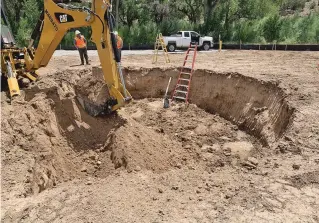  ?? COURTESY BUREAU OF RECLAMATIO­N ?? Crews perform initial excavation for collector well No. 1 of the Pojoaque Basin Regional Water System. The project will include treatment facilities, storage tanks and 150 miles of pipelines to supply up to 4,000 acrefeet of drinking water a year — about 1.3 billion gallons — to the Nambe, Tesuque, San Ildefonso and Pojoaque pueblos as well as to other Santa Fe County customers in the basin.