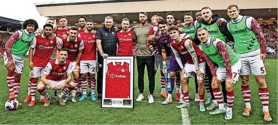  ?? Picture: Rogan Thomson/Fever Pitch ?? Nathan Baker, centre, with his former Bristol City team-mates and manager Nigel Pearson