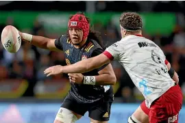  ?? GETTY IMAGES ?? Naitoa Ah Kuoi takes on Crusaders captain Scott Barrett with one of his effortless one-handed carries.