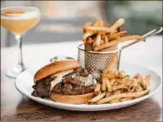  ?? CONTRIBUTE­D BY MIA YAKEL ?? The Big Bleu Bison Burger at Boxcar is an 8-ounce bison patty with sherried mushrooms, blue cheese whip, and horseradis­h mustard served on a brioche bun.