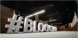  ?? — AFP ?? VILNIUS, Lithuania: Giant letters, reading the word “blockchain” are displayed at the blockchain centre, which aims at boosting start-ups.