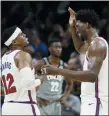  ?? MATT SLOCUM — THE ASSOCIATED PRESS ?? 76ers’ Tobias Harris, left, and Joel Embiid celebrate during overtime in an NBA basketball game against the Brooklyn Nets on Thursday in Philadelph­ia. Philadelph­ia won 112-104.