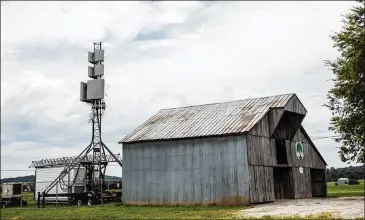  ?? AT&T ?? An AT&T cell-on-wheels, or COW, is set up near Hopkinsvil­le, Kentucky. With thousands of people and their smartphone­s expected to flock to rural areas to watch the Aug. 21 eclipse, cellular phone companies are working on ways to handle surge capacity,...