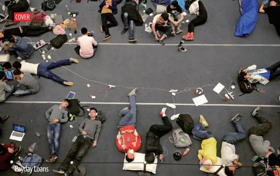  ??  ?? People wait overnight for the opening of a new Apple store in Hangzhou, Zhejiang Province, April 23, 2015